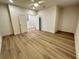 A spacious empty room with hardwood floors, bright lighting, and an open floor plan at 1059 Dryden Ln # 11, Atlanta, GA 30319
