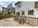 Exterior view of an expansive back deck with wooden railing and steps down into the yard at 1535 Deerwood Dr, Decatur, GA 30030