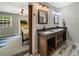 Bathroom featuring double vanity with granite countertop and access to bedroom at 1535 Deerwood Dr, Decatur, GA 30030