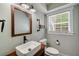Charming bathroom with vessel sink, wood-framed mirror, and modern toilet at 1535 Deerwood Dr, Decatur, GA 30030