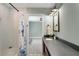 Modern bathroom features white subway tile shower and granite countertop vanity with updated fixtures and lighting at 1535 Deerwood Dr, Decatur, GA 30030