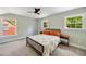 Bright bedroom features two large windows, neutral paint, ceiling fan, and plenty of space for a queen-size bed at 1535 Deerwood Dr, Decatur, GA 30030