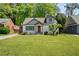 Charming bungalow home featuring a well-manicured lawn and inviting front porch at 1535 Deerwood Dr, Decatur, GA 30030