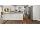 Modern kitchen with white cabinets, stainless appliances, and dark countertops at 1535 Deerwood Dr, Decatur, GA 30030