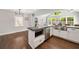 Spacious kitchen with stainless steel appliances, island with microwave, and hardwood floors at 1535 Deerwood Dr, Decatur, GA 30030