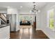 Modern open kitchen with white cabinets and stainless steel appliances with hardwood floors at 1535 Deerwood Dr, Decatur, GA 30030