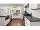 Charming kitchen with stainless steel appliances, granite countertops, and white cabinets at 1535 Deerwood Dr, Decatur, GA 30030