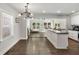 Modern kitchen with white cabinets, dark countertops, and stainless steel appliances at 1535 Deerwood Dr, Decatur, GA 30030
