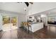 Open kitchen with large island, stainless steel appliances, and sliding door to deck at 1535 Deerwood Dr, Decatur, GA 30030