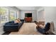 Bright living room featuring hardwood floors, a comfortable couch, and a large window at 1535 Deerwood Dr, Decatur, GA 30030