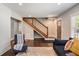 Inviting living room with hardwood floors, staircase and modern decor at 1535 Deerwood Dr, Decatur, GA 30030