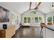 Sunroom featuring lots of natural light, vaulted ceilings, and hardwood floors at 1535 Deerwood Dr, Decatur, GA 30030