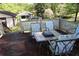 Outdoor back deck with table and chairs at 1646 Hurt Sw Rd, Marietta, GA 30008