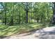 Lush backyard with mature trees and plenty of space at 1646 Hurt Sw Rd, Marietta, GA 30008