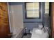 Bathroom featuring a shower-tub combo and vanity sink at 1646 Hurt Sw Rd, Marietta, GA 30008
