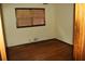 This bedroom features hardwood floors and natural lighting at 1646 Hurt Sw Rd, Marietta, GA 30008