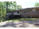 Brick house featuring a deck and yard at 1646 Hurt Sw Rd, Marietta, GA 30008