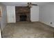 Living room with carpet and a classic brick fireplace, ready for cozy evenings at 1646 Hurt Sw Rd, Marietta, GA 30008