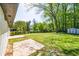 A sprawling backyard featuring a green lawn and storage shed at 3719 Paul St, Douglasville, GA 30135