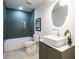 A modern bathroom featuring a sleek vanity and beautifully tiled shower at 3719 Paul St, Douglasville, GA 30135