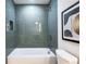 Modern bathroom with a tiled shower-over-tub, updated fixtures, and sleek design at 3719 Paul St, Douglasville, GA 30135