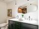 This bathroom is complete with dual sinks, modern fixtures, and statement mirror at 3719 Paul St, Douglasville, GA 30135