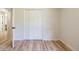 Bedroom showing bi-fold closet doors and new light wood flooring at 3719 Paul St, Douglasville, GA 30135