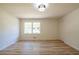 Spacious bedroom with a large window, ample natural light, and neutral walls at 3719 Paul St, Douglasville, GA 30135
