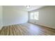 Sun-filled bedroom with wood-look floors and a bright, airy ambiance at 3719 Paul St, Douglasville, GA 30135