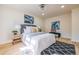 A sunlit bedroom with stylish decor, fresh colors, and a patterned area rug at 3719 Paul St, Douglasville, GA 30135
