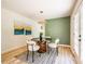 Bright dining space with a modern light fixture, stylish decor, and outdoor access at 3719 Paul St, Douglasville, GA 30135