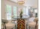 Chic dining area featuring modern lighting, stylish table, and access to the outdoors at 3719 Paul St, Douglasville, GA 30135