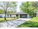 Charming single-story home with a well-maintained lawn and modern front door at 3719 Paul St, Douglasville, GA 30135