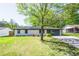 Beautifully landscaped front yard with a classic home design and lush greenery at 3719 Paul St, Douglasville, GA 30135