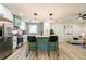 Stylish kitchen with a large island, modern lighting, and stainless steel refrigerator at 3719 Paul St, Douglasville, GA 30135