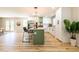 Bright kitchen featuring a green island, white cabinets and stainless steel appliances at 3719 Paul St, Douglasville, GA 30135