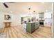 Open kitchen with island, stainless appliances, and view of dining area at 3719 Paul St, Douglasville, GA 30135