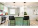 Modern kitchen features stylish countertops, stainless steel appliances, and a green island at 3719 Paul St, Douglasville, GA 30135