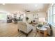 Open-concept living room flows into modern kitchen with stainless steel appliances and island seating at 3719 Paul St, Douglasville, GA 30135