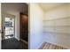 Open walk-in closet with wire shelving and easy access to the en suite bathroom at 3719 Paul St, Douglasville, GA 30135
