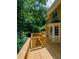 Expansive wooden deck with railing and lush green surroundings, perfect for relaxation and entertaining guests at 4503 Rivercliff Sw Dr, Lilburn, GA 30047