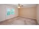 Cozy bedroom with large window letting in natural light and neutral colored walls at 4503 Rivercliff Sw Dr, Lilburn, GA 30047