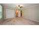 Spacious bedroom featuring carpet, a ceiling fan, and a large closet at 4503 Rivercliff Sw Dr, Lilburn, GA 30047