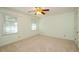 Bedroom featuring carpet, two windows, and ceiling fan at 4503 Rivercliff Sw Dr, Lilburn, GA 30047