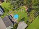 Stunning aerial view showcasing a pool, sprawling yard, and mature trees, creating a private oasis at 5539 Hurstcliffe Nw Dr, Kennesaw, GA 30152