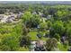 Lush, wooded aerial showcasing a home with a pool in a suburban neighborhood at 5539 Hurstcliffe Nw Dr, Kennesaw, GA 30152