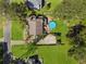 Aerial view of home with pool, patio, large lawn, and driveway at 5539 Hurstcliffe Nw Dr, Kennesaw, GA 30152