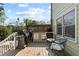 Back deck with grilling and outdoor cooking space with chairs and a small table at 5539 Hurstcliffe Nw Dr, Kennesaw, GA 30152