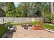 Paver patio with outdoor furniture and a fire pit in a fenced backyard at 5539 Hurstcliffe Nw Dr, Kennesaw, GA 30152