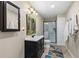 Bathroom with modern vanity, framed mirror, and a glass enclosed shower at 5539 Hurstcliffe Nw Dr, Kennesaw, GA 30152